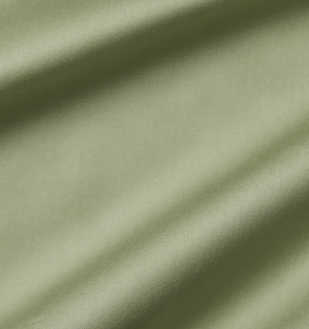 Close-up of green fabric with folds